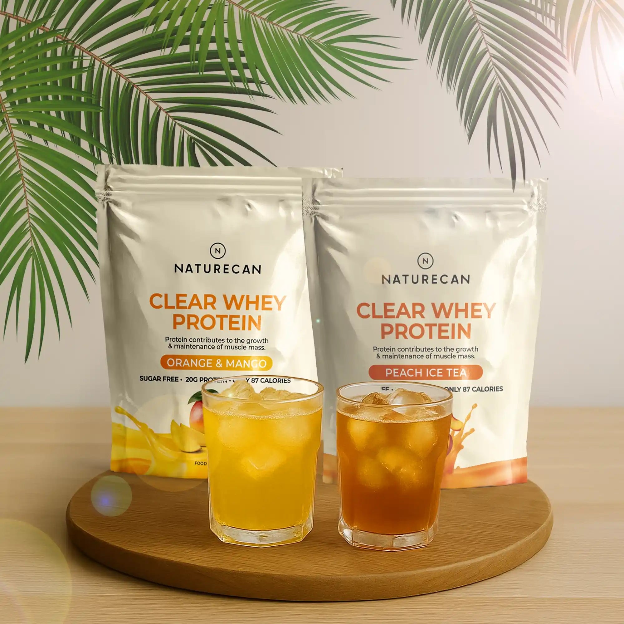 Clear Whey Protein Naturecan w smakach mango i pomarańcza oraz mrożona herbata brzoskwiniowa
